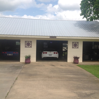 Three-car garage with sports cars and storage shelves - Bruce from Enterprise, AL