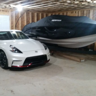 Garage With White Sports Car and Covered Boat - Jeffrey from Sydney, Nova Scotia