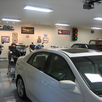Organized Garage with Motorcycles, Cars, and Wall Decor - DPD from Demorest, GA