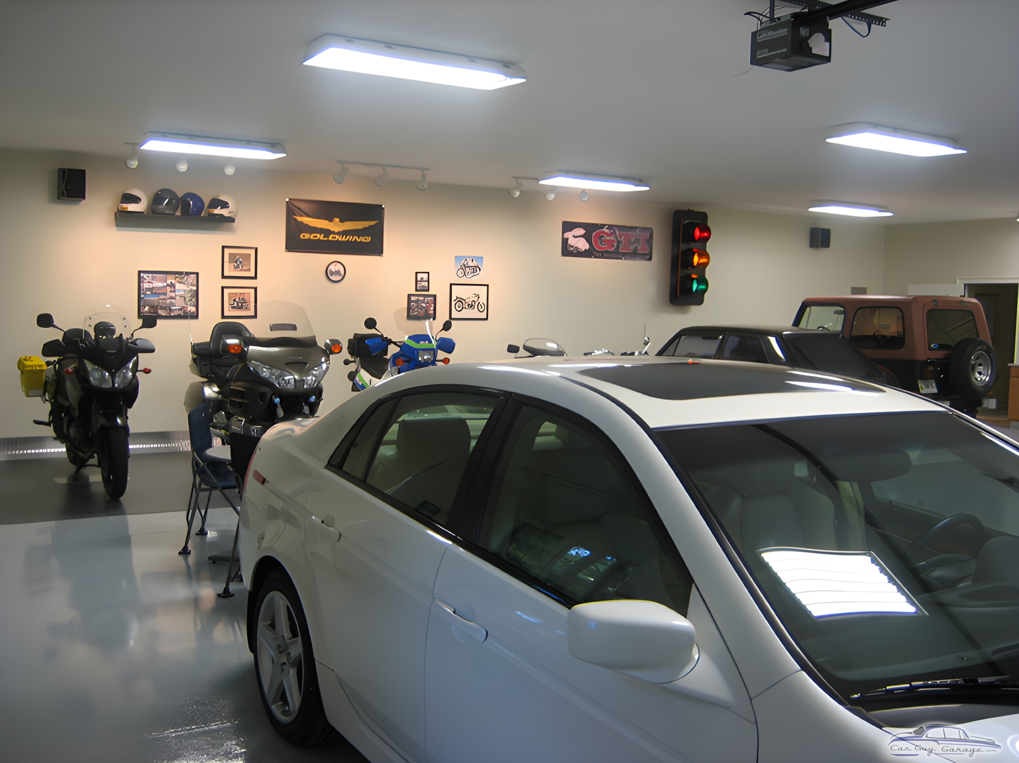 Organized Garage with Motorcycles, Cars, and Wall Decor - DPD from Demorest, GA