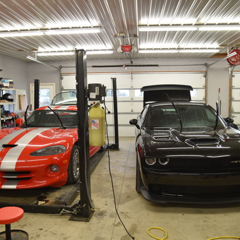 Organized garage with car lift, muscle cars, and storage - Nicholas Oxender from Shipshewana, Indiana