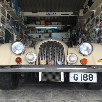 Classic car with wall plaques and garage decor - Michael from Gibraltar, Europe