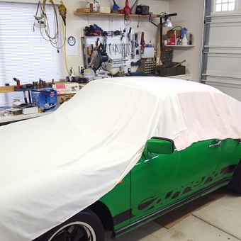 Organized garage with covered green car and tool storage - bcgreen from Hayden Lake, Idaho