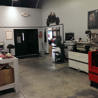 Organized garage workspace with machinery and workbenches - Kevin Baxter from Lawrenceville, Georgia