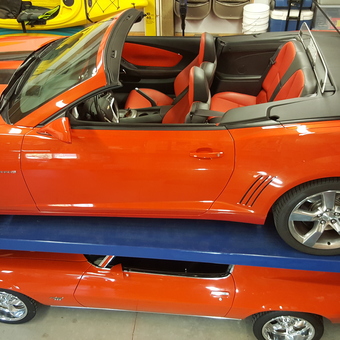 Two Orange Muscle Cars on Garage Car Lift - Bill from Pasco, Washington