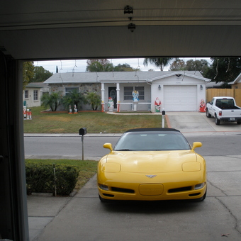 Yellow Corvette Parked in Driveway Outside Garage - George from Port Richey, Florida