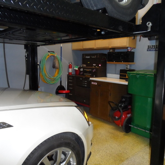 Organized garage with car lift, tool chest, and cabinets - MrClean from Tipp City, Ohio
