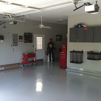 Organized garage with storage cabinets and tool carts - Jason from Fenton, MO