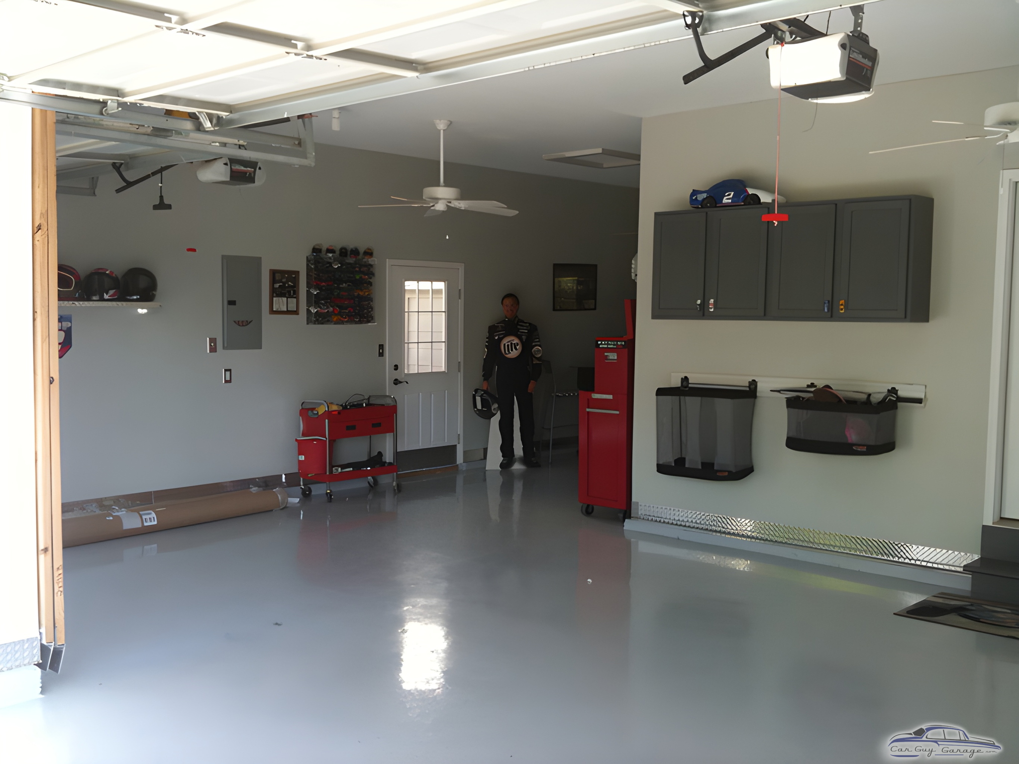 Organized garage with storage cabinets and tool carts - Jason from Fenton, MO