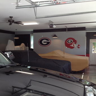 Organized garage with car covers and sports decor - Chris from Bishop, GA