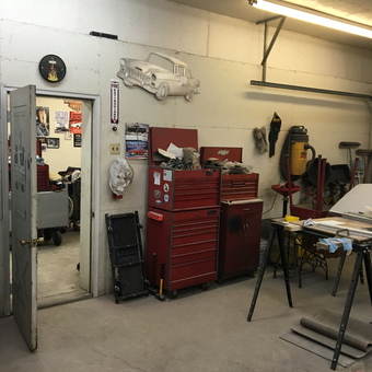Organized garage with red tool chests and wall art - BILL from Houston, OH