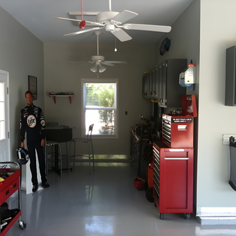 Organized garage with red tool chests and wall cabinets - Jason from Fenton, MO