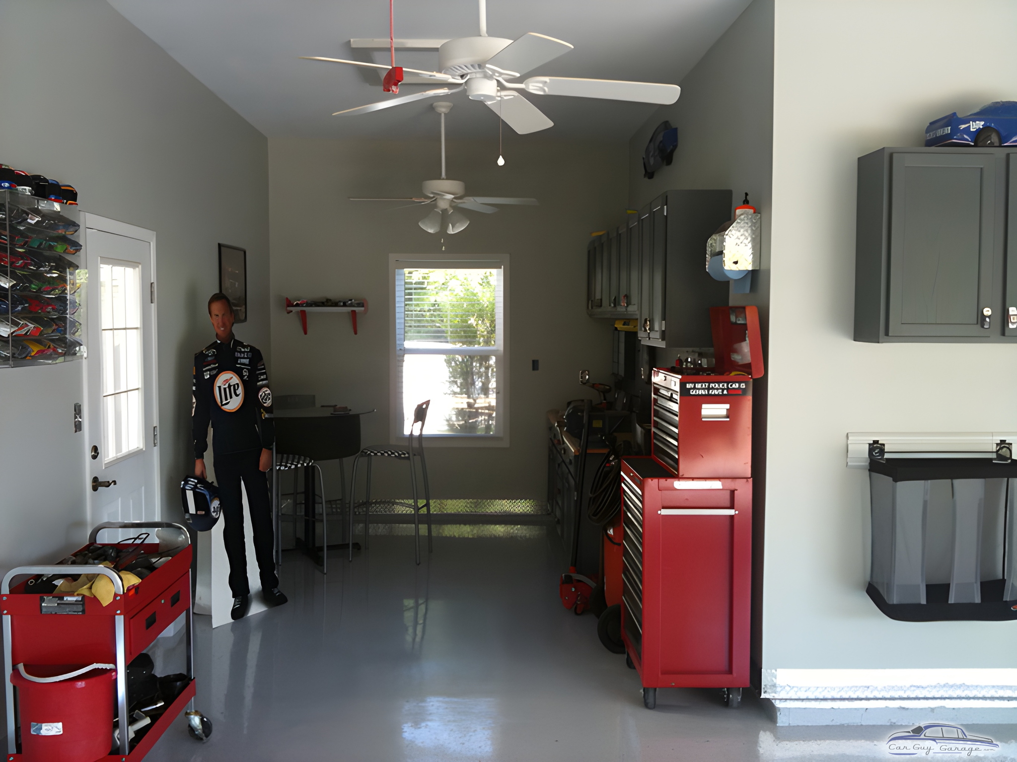 Organized garage with red tool chests and wall cabinets - Jason from Fenton, MO