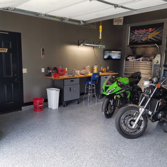 Organized garage with motorcycles, workbench, and storage - Scott from Edmond, Oklahoma