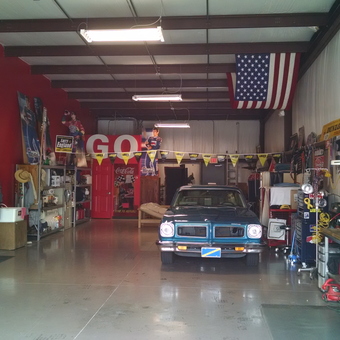 Classic car, workbench, and racing decor in spacious garage - Ace Ventura from Johnson City, TENNESSEE