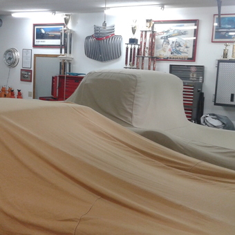 Organized garage with car covers, tool cabinets, and trophies - Pat Jackson from Johnstown, Ohio