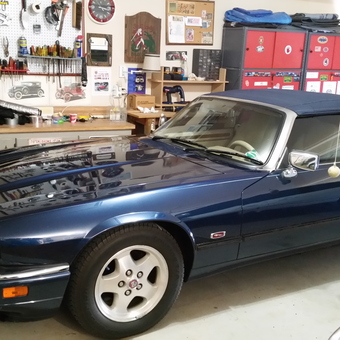 Organized garage with classic car, wall pegboard, and red cabinets - Daryle from Oklahoma City, OKLAHOMA