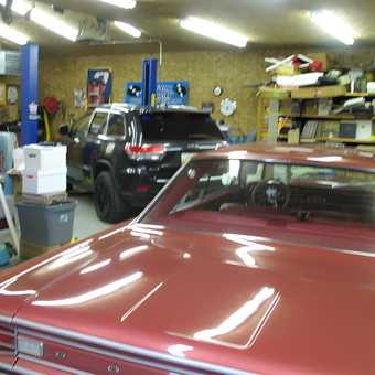 Organized garage with car lifts, shelving, and classic cars - Rod from Chelsea, MI