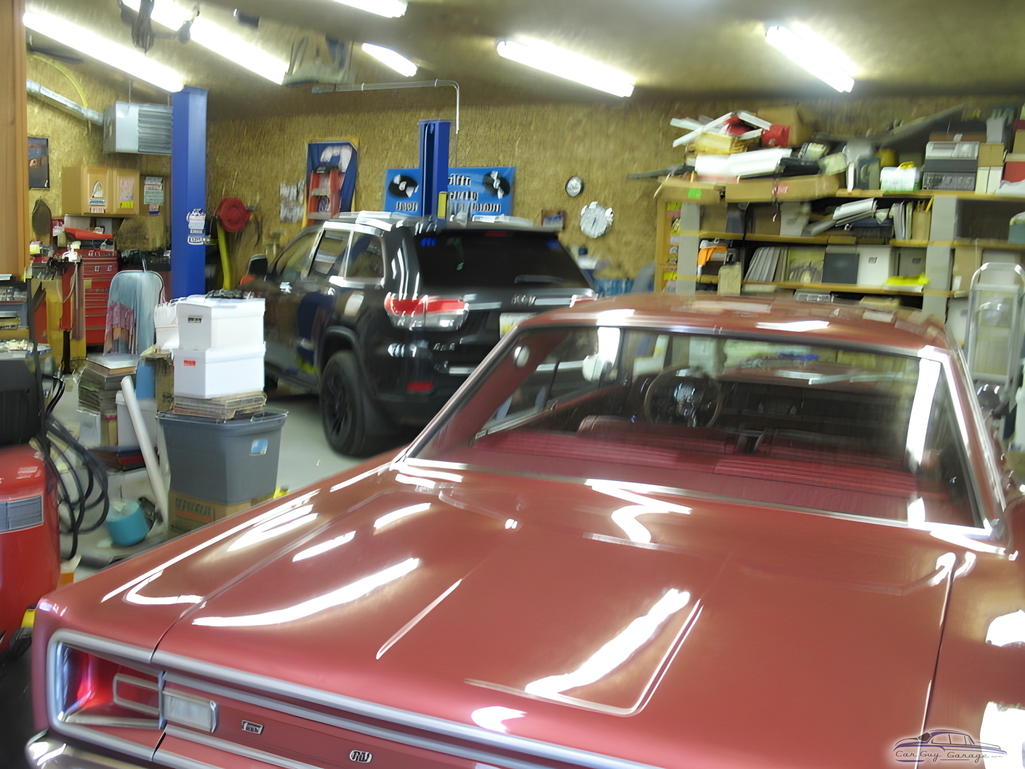 Organized garage with car lifts, shelving, and classic cars - Rod from Chelsea, MI