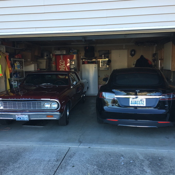 Organized two-car garage with classic and modern vehicles - Jason from Kelso, Wa