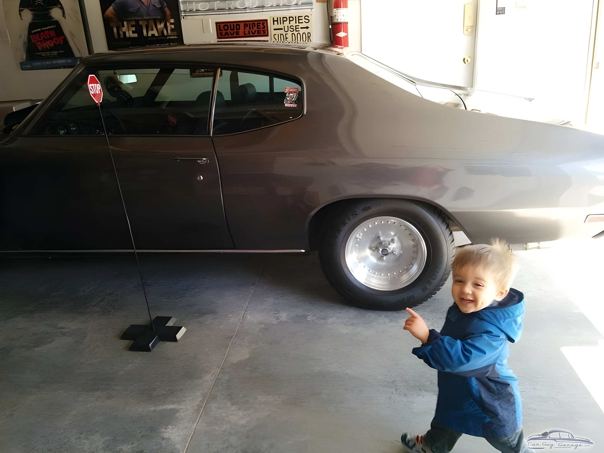 Classic muscle car, stop sign, posters in garage - Nelson from Ottawa, Ontario