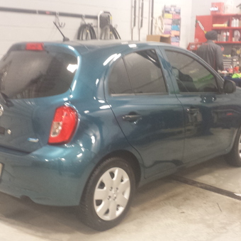 Organized garage with blue hatchback and wall storage - Terrence from Pembroke, Ontario