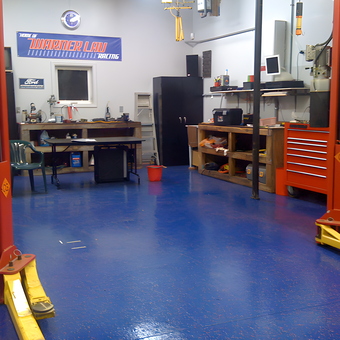 Organized garage with car lift, tool cabinets, and workbenches - David from Plymouth, MI