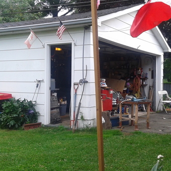 Organized garage workspace with tools and truck - Grant Garage from Ottawa, Ontario