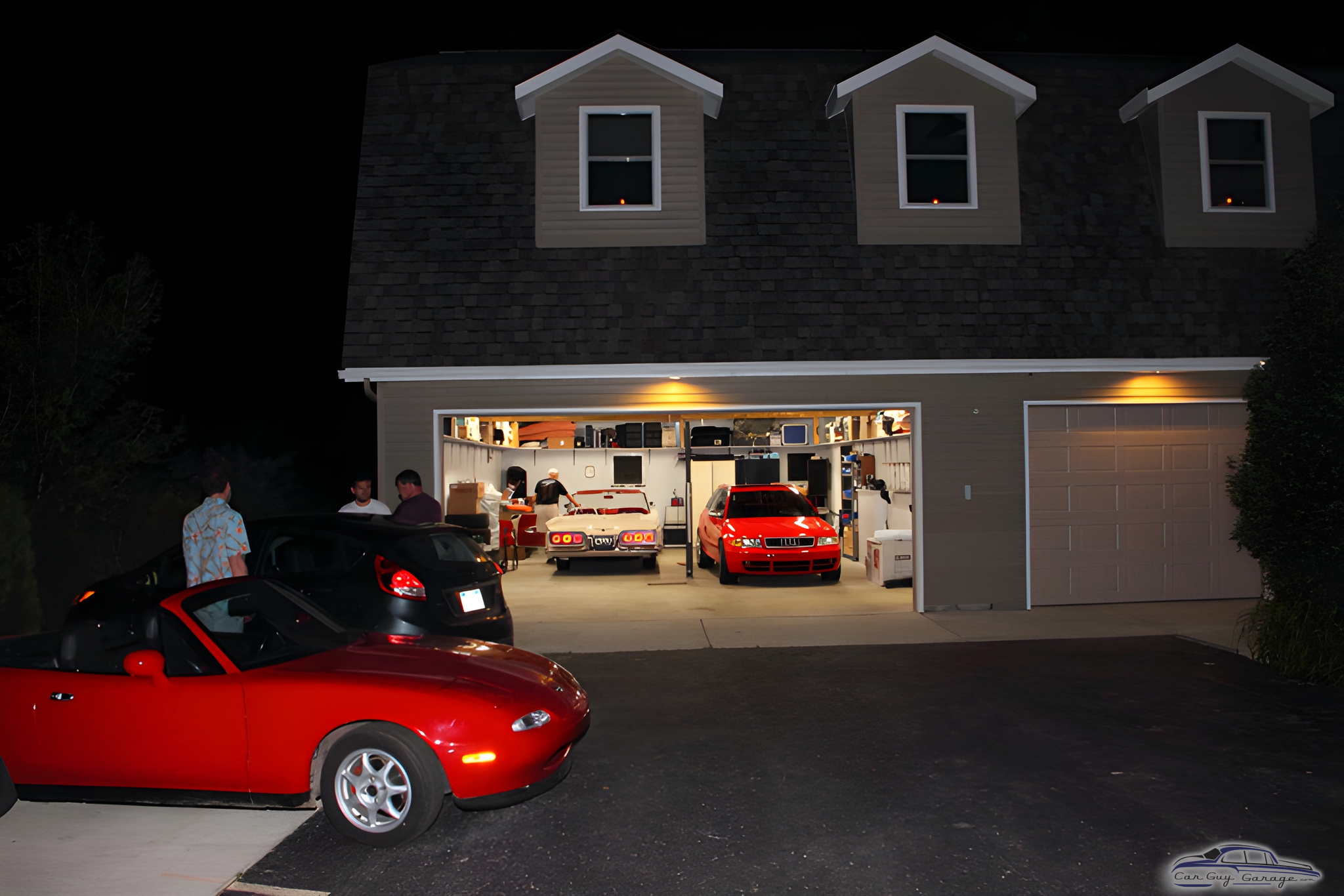 Spacious garage with red sports cars and storage - David from Plymouth, MI