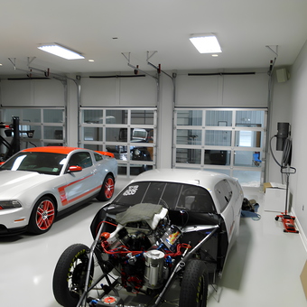 Modern garage with race cars and tools - Louis from Bourg, LA