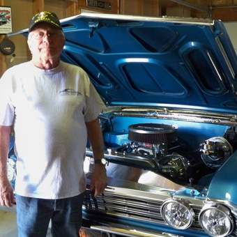 Classic blue muscle car in garage with wall signs - chevyman from longview, washington