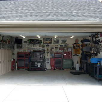 Organized garage with tool chests, lockers, and wall decor - Bobby B from Columbiana, Ohio