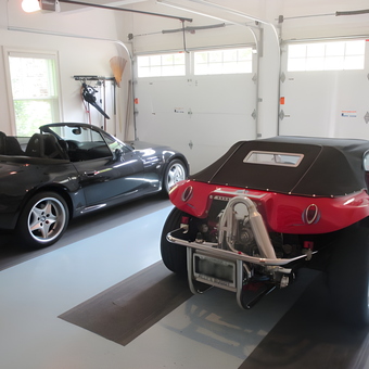 Organized garage with sports cars and wall storage - Bob from Ipswich, Ma