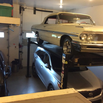 Home garage with car lift and classic car storage - Nedle from Carstairs, AB
