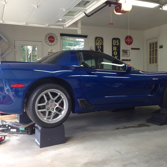 Blue Corvette on Race Ramps in Organized Garage - Rog from Princeton, IL