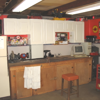Organized garage with cabinets, tool chest, and workbench - Hare from Mentor, Ohio