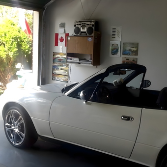Garage with White Convertible, Wall Art, and Storage - Ron from Ottawa, ON