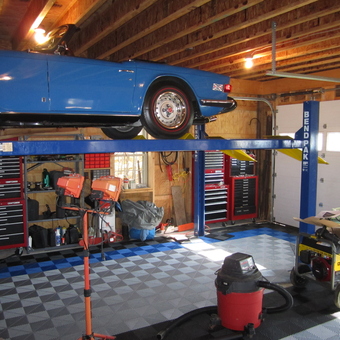 Organized garage with car lift, tool chests, and lighting - Skip250 from Forestville, NY