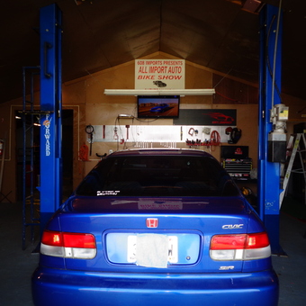 Garage With Car Lift, Tool Storage, and Honda Civic - squirrelly from viola, WI
