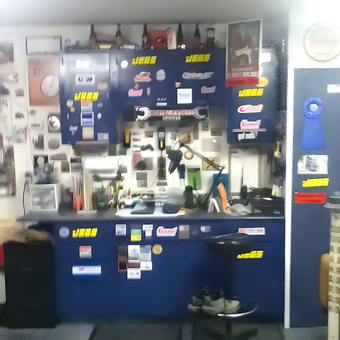 Organized garage workbench with blue cabinets and stool - Vic from New Philadelphia, OH