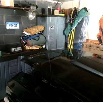 Organized garage with cabinets, shelving, and storage bins - John from Milford, CT