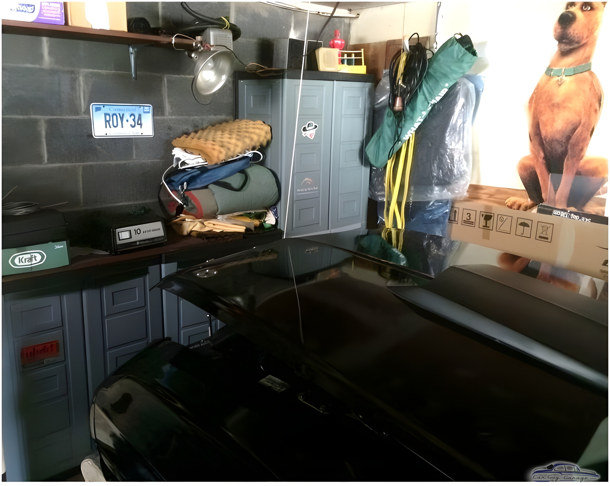 Organized garage with cabinets, shelving, and storage bins - John from Milford, CT