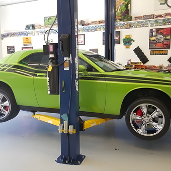 Green muscle car on two post lift in custom garage - Donalda from Ulysses, KS
