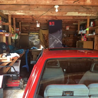 Organized Wooden Garage With Red Car and Tools - Emily from Roanoke, Va
