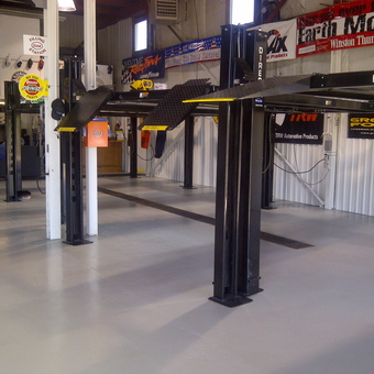 Spacious garage with car lifts and wall signs - roid from Kitchener, Ontario