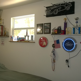 Garage Wall with Car Signs, Neon Clock, and Trophies - Rick & Nancy from Panama City, FL