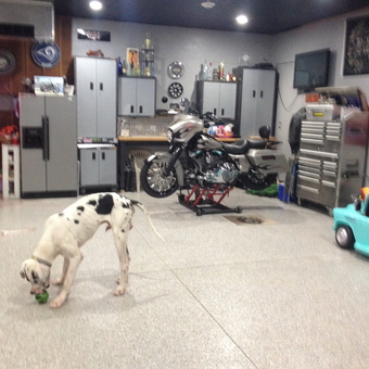Organized garage with storage cabinets and motorcycle lift - Rob from Palmyra, IL