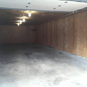 Spacious unfinished garage with lighting and concrete floor - feednspeed from Belvidere, il