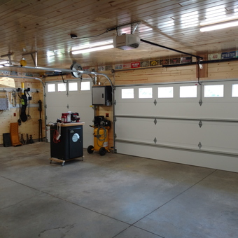 Organized Wood Garage With Tools and Storage - The Brat Guy from Huxley, IA