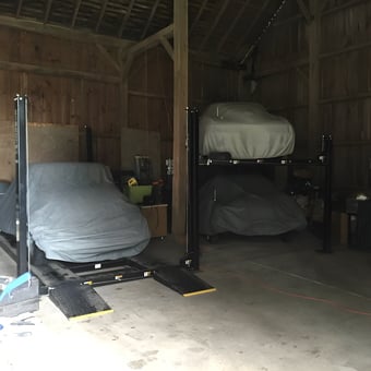Car Lifts and Covered Cars in Spacious Wooden Garage - Mr. Corvette from Yoder, IN